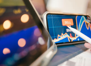 Trader examining Bitcoin, Ethereum and forex options across multiple markets